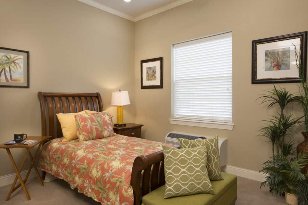 apartment bed in The Legacy at Highwoods Preserve pictured