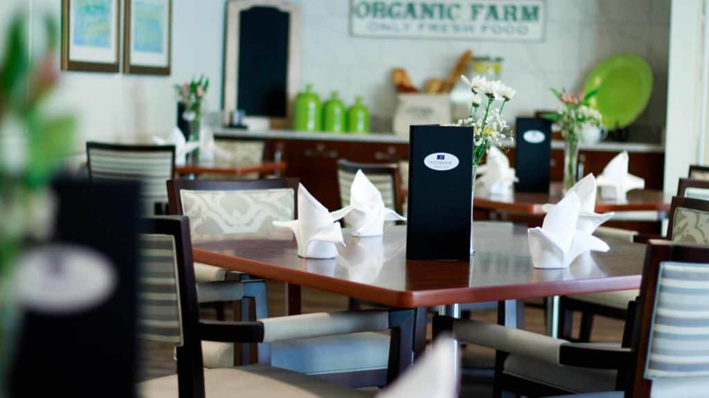 restaurant style dining at The Legacy at Highwoods Preserve memory care community pictured
